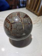 Load image into Gallery viewer, Septarian Sphere Druzy 4 in/100 mm

